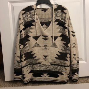 Beige, hooded sweater with symmetrical pattern